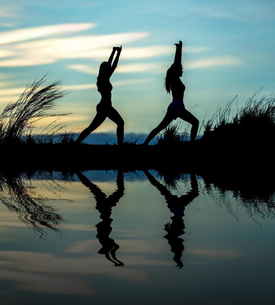 women, yoga, silhouettes, water, reflection, mirroring, water reflection, pose, posing, yoga pose, meditation, stretching, wellness, well-being, nature, exercise, adults, asia, girls, morning, outdoors, pair, people, stance, sunrise, sunset